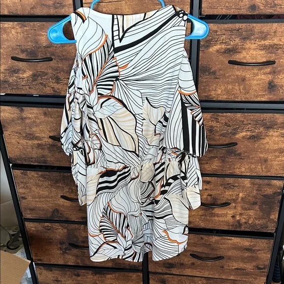 Adelyn Rae Black and Orange Patterned Romper - Picture 7 of 9